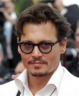 Cast member Johnny Depp poses as he arrives on the red carpet for the screening of the film "Pirates Of The Caribbean: On Stranger Tides" at the 64th Cannes Film Festival, May 14, 2011. REUTERS/Jean-Paul Pelissier
Cast member Johnny Depp poses as he arrives on the red carpet for the screening of the film "Pirates Of The Caribbean: On Stranger Tides" at the 64th Cannes Film Festival, May 14, 2011. REUTERS/Jean-Paul Pelissier