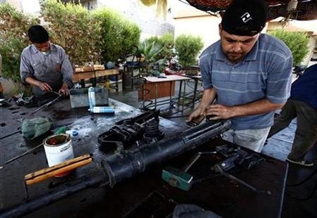 Libyan volunteers fix jammed weapons captured from Muammar Gaddafi forces at a workshop in Misrata Libyan volunteers fix jammed weapons captured from Muammar Gaddafi forces at a workshop in Misrata