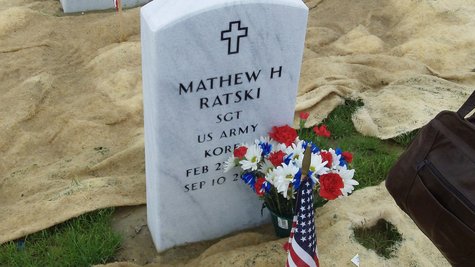 Patriotic flowers are set against the tombstone of Korean War vet Matt Ratski at the Great Lakes National Cemetery in Holly, MI on May 29, 2011 Patriotic flowers are set against the tombstone of Korean War vet Matt Ratski at the Great Lakes National Cemetery in Holly, MI on May 29, 2011