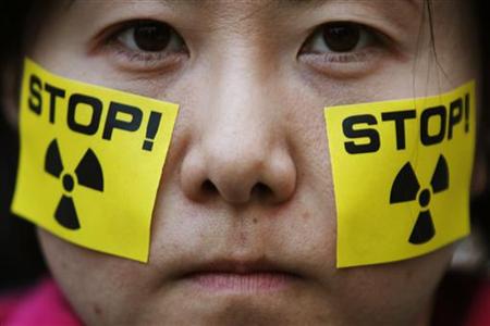 An anti-nuclear protester takes part in a rally in front of Tokyo Electric Power's headquarters in Tokyo An anti-nuclear protester takes part in a rally in front of Tokyo Electric Power's headquarters in Tokyo