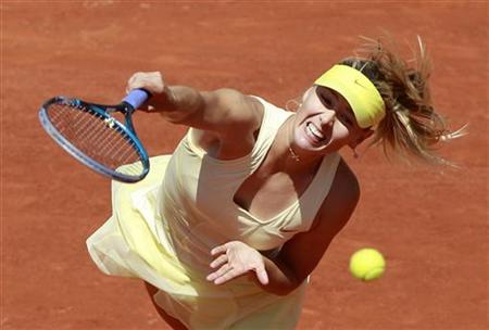 Sharapova of Russia serves to Petkovic of Germany during their quarter-final match at the French Open tennis tournament at the Roland Garros Sharapova of Russia serves to Petkovic of Germany during their quarter-final match at the French Open tennis tournament at the Roland Garros