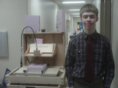 EGL student Marshal Scholz shows off his homebuilt automated router at the EGL final project open house, June 2011 EGL student Marshal Scholz shows off his homebuilt automated router at the EGL final project open house, June 2011
