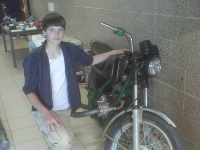 Wausau student Christopher Emmerich shows off his homebuilt motorcycle at the EGL final projects open house, June 2011 Wausau student Christopher Emmerich shows off his homebuilt motorcycle at the EGL final projects open house, June 2011