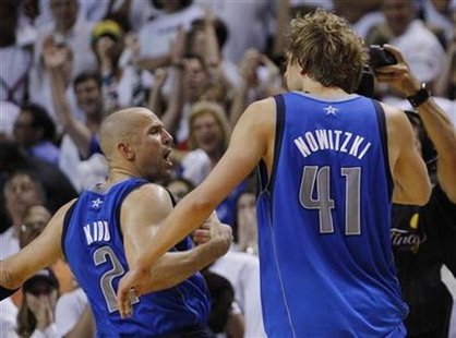 Mavericks' Kidd celebrates with teammate Nowitzki after a basket against the Heat during Game 2 of the NBA Finals basketball series in Miami Mavericks' Kidd celebrates with teammate Nowitzki after a basket against the Heat during Game 2 of the NBA Finals basketball series in Miami