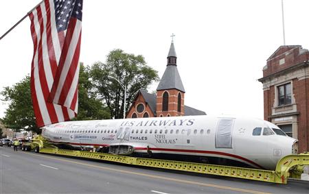 U.S. Airways flight 1549 also known as the "Miracle on the Hudson" is hauled on a truck through the streets in Elizabeth, New Jersey U.S. Airways flight 1549 also known as the "Miracle on the Hudson" is hauled on a truck through the streets in Elizabeth, New Jersey