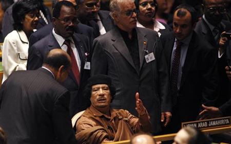 Libyan leader Muammar Gaddafi waits at his seat to be escorted to the podium before addressing the 64th United Nations General Assembly in N Libyan leader Muammar Gaddafi waits at his seat to be escorted to the podium before addressing the 64th United Nations General Assembly in N
