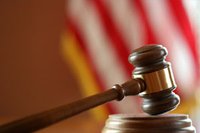 Court gavel with flag