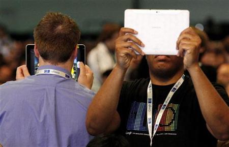Attendees record their surroundings on tablet computers before the keynote address at the Google I/O Developers Conference Attendees record their surroundings on tablet computers before the keynote address at the Google I/O Developers Conference