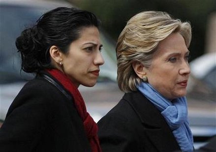 Democratic presidential candidate Senator Clinton (D-NY) walks with traveling chief-of-staff Abedin as they approach a group of police offic Democratic presidential candidate Senator Clinton (D-NY) walks with traveling chief-of-staff Abedin as they approach a group of police offic