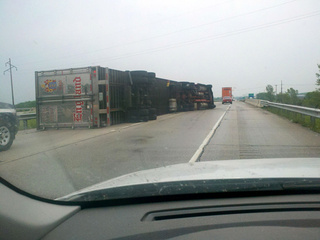 A semi is seen tipped onto its side on Interstate 43 in Manitowoc County, June 8, 2011. (Photo submitted by Scott Woitekaitis to FOX 11)
