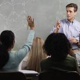 A teacher in a classroom A teacher in a classroom