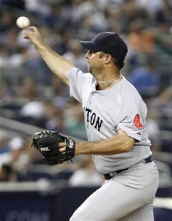 Red Sox starting pitcher Tim Wakefield releases a pitch during the fifth inning of American League MLB baseball action at Yankee Stadium in Red Sox starting pitcher Tim Wakefield releases a pitch during the fifth inning of American League MLB baseball action at Yankee Stadium in