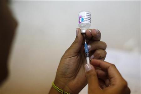A nurse prepares a vaccine A nurse prepares a vaccine