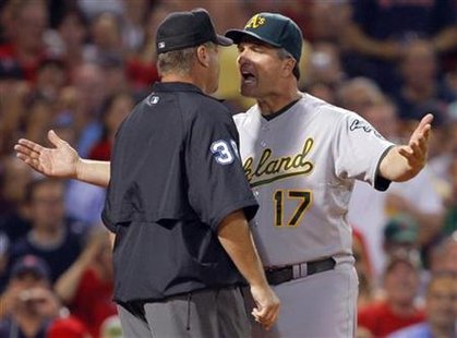 Oakland Athletics manager Bob Geren argues with third base umpire Gary Cederstrom in the third inning of their MLB American League baseball Oakland Athletics manager Bob Geren argues with third base umpire Gary Cederstrom in the third inning of their MLB American League baseball