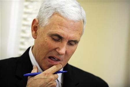 U.S. Representative Pence looks at his notes before a news conference at the U.S. Capitol in Washington U.S. Representative Pence looks at his notes before a news conference at the U.S. Capitol in Washington