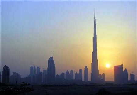 The Burj Khalifa is seen as the sun sets over Dubai The Burj Khalifa is seen as the sun sets over Dubai