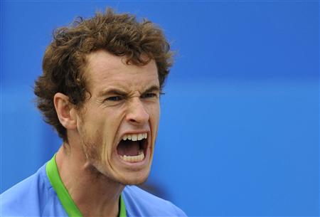 Murray of Britain reacts after winning the second set during his singles final match against Tsonga of France at the Queen's Club Championsh Murray of Britain reacts after winning the second set during his singles final match against Tsonga of France at the Queen's Club Championsh