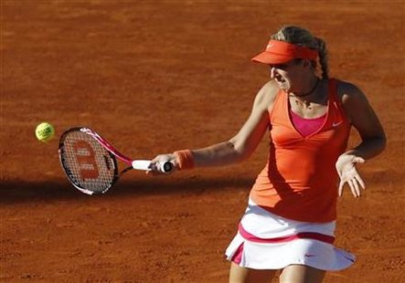 Lisicki of Germany returns the ball to Zvonareva of Russia during the French Open tennis tournament at the Roland Garros stadium in Paris Lisicki of Germany returns the ball to Zvonareva of Russia during the French Open tennis tournament at the Roland Garros stadium in Paris