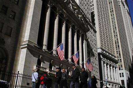 Pedestrians walk past the New York Stock Exchange Pedestrians walk past the New York Stock Exchange