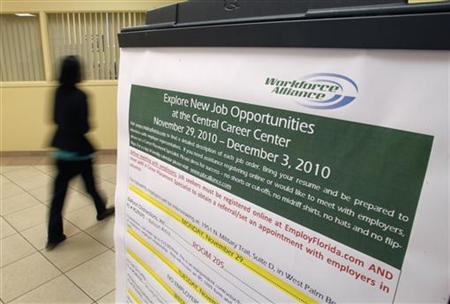 A job seeker walks past a sign at the Workforce Alliance Career Center in West Palm Beach A job seeker walks past a sign at the Workforce Alliance Career Center in West Palm Beach