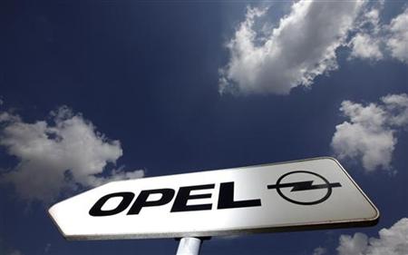 A sign indicates the way towards the headquarters of German car manufacturer Opel in Ruesselsheim