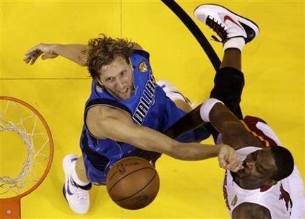 Mavericks power forward Nowitzki stops Heat power forward Bosh from scoring in the second half during Game 6 in Miami Mavericks power forward Nowitzki stops Heat power forward Bosh from scoring in the second half during Game 6 in Miami