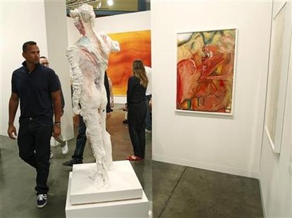 New York Yankees baseball player Rodriquez looks at artwork during a preview of the Art Basel Miami Beach art show at the Miami Beach Conven New York Yankees baseball player Rodriquez looks at artwork during a preview of the Art Basel Miami Beach art show at the Miami Beach Conven