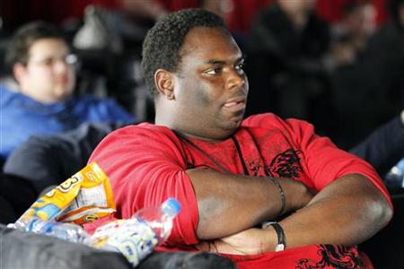 A 'couch potato' attempting to set new Guinness World Record for continuous television viewing sits near some snacks in Hollywood A 'couch potato' attempting to set new Guinness World Record for continuous television viewing sits near some snacks in Hollywood