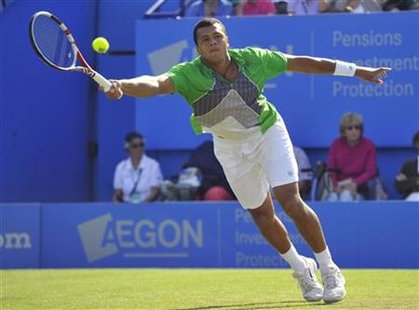 Jo-Wilfried Tsonga of France returns the ball during his International Men's Open tennis tournament match against Denis Istomin of Uzbekista Jo-Wilfried Tsonga of France returns the ball during his International Men's Open tennis tournament match against Denis Istomin of Uzbekista