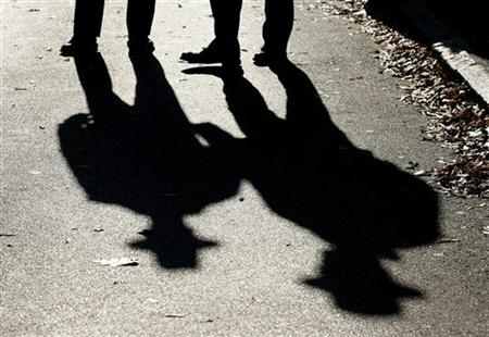 Police officers cast shadows in Annapolis Police officers cast shadows in Annapolis