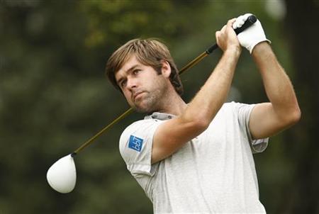 Britain's Rock watches his shot from the third tee in the first round of the 2011 U.S. Open in Maryland Britain's Rock watches his shot from the third tee in the first round of the 2011 U.S. Open in Maryland