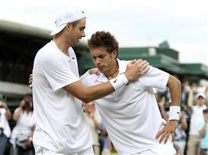 John Isner of the U.S. embraces France's Nicolas Mahut after defeating him at the 2010 Wimbledon tennis championships in London John Isner of the U.S. embraces France's Nicolas Mahut after defeating him at the 2010 Wimbledon tennis championships in London