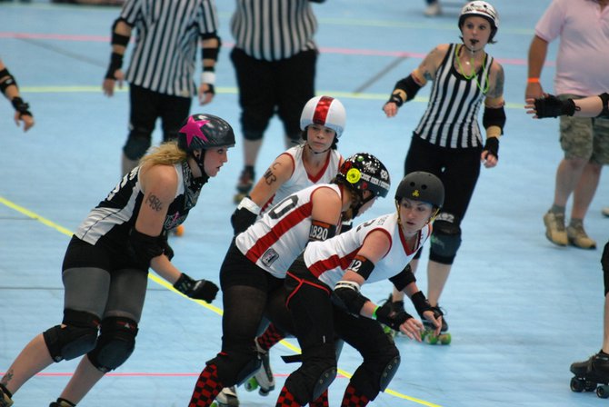 The Killamazoo Derby Darlins take on the Naptown Warning Belles at Wings Stadium 06/18/11. Photos by Sean Patrick Duross.