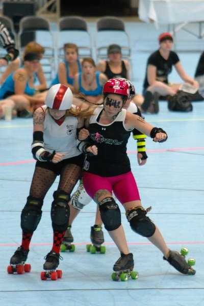 The Killamazoo Derby Darlins take on the Naptown Warning Belles at Wings Stadium 06/18/11.  Photos by Sean Patrick Duross.