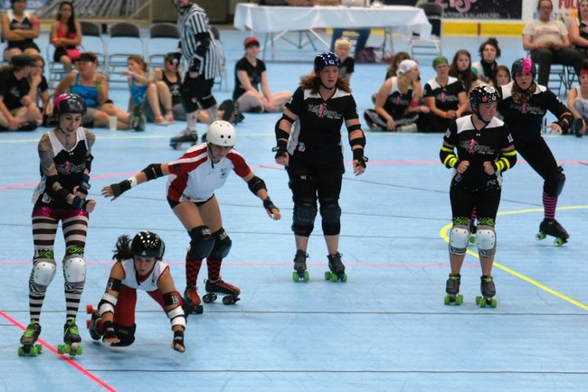 The Killamazoo Derby Darlins take on the Naptown Warning Belles at Wings Stadium 06/18/11.  Photos by Sean Patrick Duross.