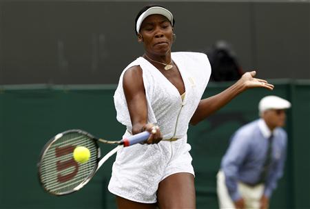 Venus Williams of the U.S. hits a return to Akgul Amanmuradova of Uzbekistan at the Wimbledon tennis championships in London Venus Williams of the U.S. hits a return to Akgul Amanmuradova of Uzbekistan at the Wimbledon tennis championships in London