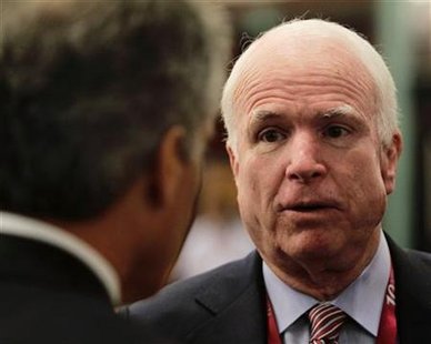 U.S. Senator McCain speaks to Australia's Defence Minister Smith during the IISS Asia Security Summit in Singapore U.S. Senator McCain speaks to Australia's Defence Minister Smith during the IISS Asia Security Summit in Singapore