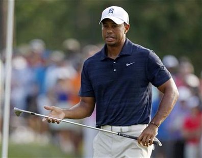 Woods reacts during first round play in the Players Championship golf tournament in Ponte Vedra Beach Woods reacts during first round play in the Players Championship golf tournament in Ponte Vedra Beach