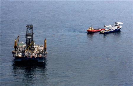 Oil floats on the surface of the Gulf of Mexico around the Transocean Development Driller III, which is drilling a relief well, at the site Oil floats on the surface of the Gulf of Mexico around the Transocean Development Driller III, which is drilling a relief well, at the site