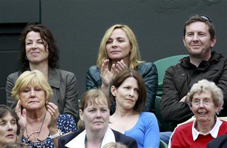 Actress Kim Cattrall watches the match between Venus Williams of the U.S. and Kimiko Date-Krumm of Japan at the Wimbledon tennis championshi Actress Kim Cattrall watches the match between Venus Williams of the U.S. and Kimiko Date-Krumm of Japan at the Wimbledon tennis championshi