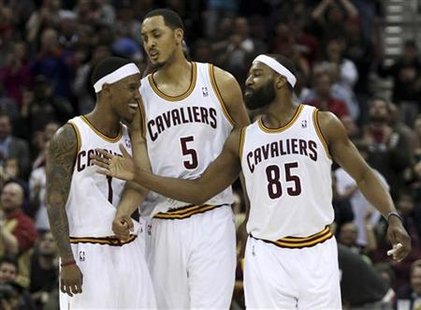 Cleveland Cavalier's Daniel Gibson, Ryan Hollins and Baron Davis celebrate during the fourth quarter of their NBA basketball game against th Cleveland Cavalier's Daniel Gibson, Ryan Hollins and Baron Davis celebrate during the fourth quarter of their NBA basketball game against th