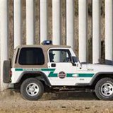 Border Patrol agent drags border road next to tiers of fences along US-Mexico border in San Diego Border Patrol agent drags border road next to tiers of fences along US-Mexico border in San Diego
