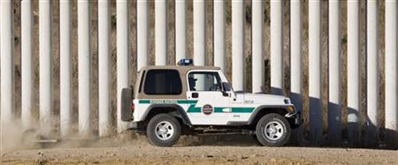 Border Patrol agent drags border road next to tiers of fences along US-Mexico border in San Diego Border Patrol agent drags border road next to tiers of fences along US-Mexico border in San Diego