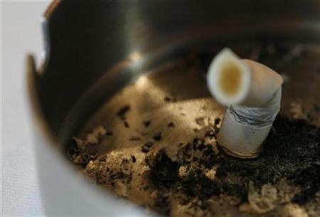 An extinguished cigarette is pictured in a bar in downtown Zurich An extinguished cigarette is pictured in a bar in downtown Zurich
