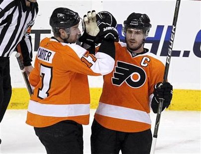Philadelphia Flyers' Richards celebrates his game-winning goal against Ottawa Senators with teammate Carter during their NHL hockey game in Philadelphia Flyers' Richards celebrates his game-winning goal against Ottawa Senators with teammate Carter during their NHL hockey game in