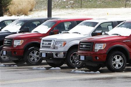 A row of new Ford F-150 pickup trucks are parked for sale at a Ford dealer in the Denver suburb of Broomfield A row of new Ford F-150 pickup trucks are parked for sale at a Ford dealer in the Denver suburb of Broomfield
