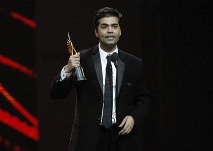 Johar accepts his award for best directo rduring the IIFA awards show in Toronto Johar accepts his award for best directo rduring the IIFA awards show in Toronto