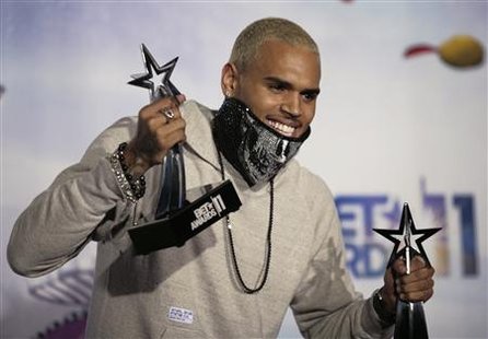Singer Chris Brown poses for photographers with two of the four BET Award he won at the 2011 BET Awards in Los Angeles Singer Chris Brown poses for photographers with two of the four BET Award he won at the 2011 BET Awards in Los Angeles