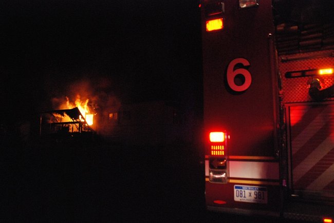 A trailer in Kalamazoo is fully engulfed in flames - a passing motorist helped everyone escape unharmed. Photos by Sean Patrick Duross.