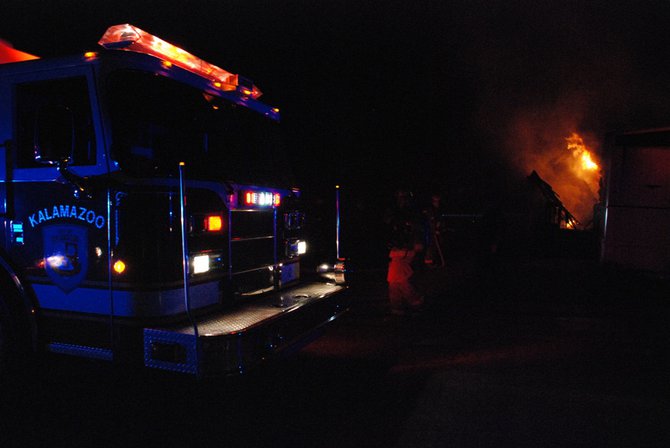 A trailer in Kalamazoo is fully engulfed in flames - a passing motorist helped everyone escape unharmed. Photos by Sean Patrick Duross.